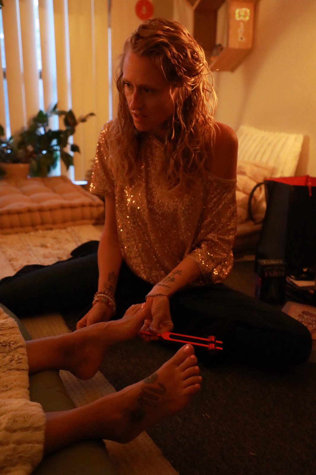 Alicia Wright leading a sound healing session with a tuning fork