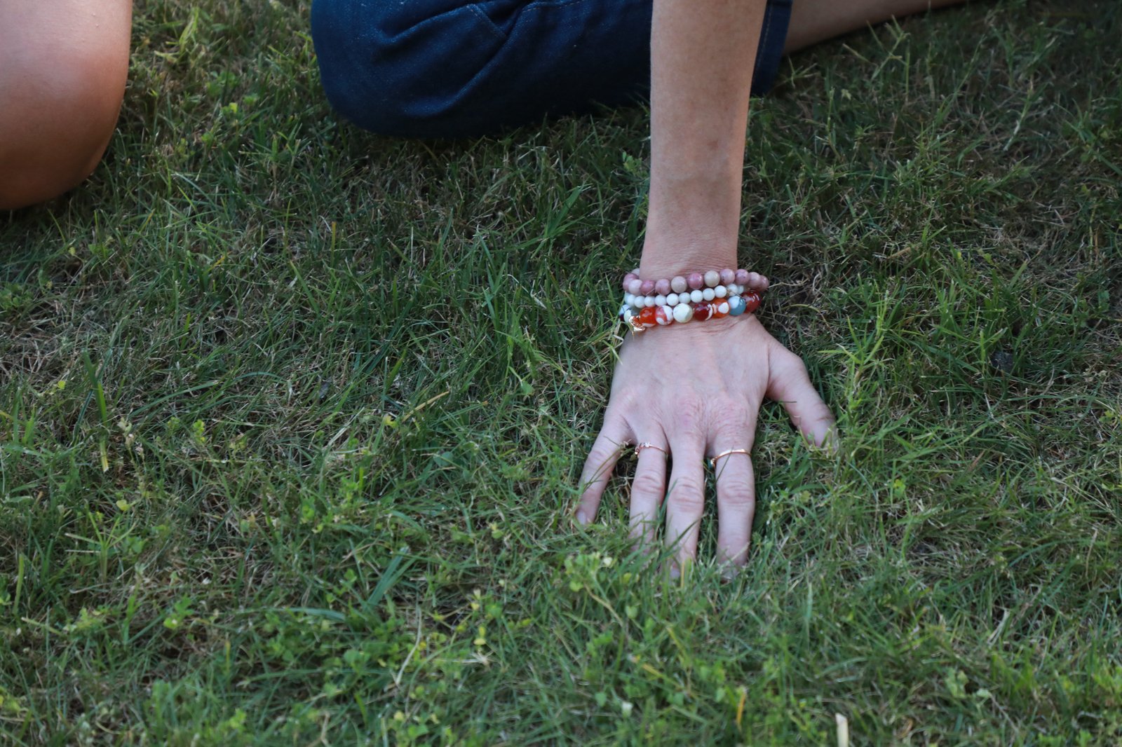 A grounding moment with mala beads on Arizona earth