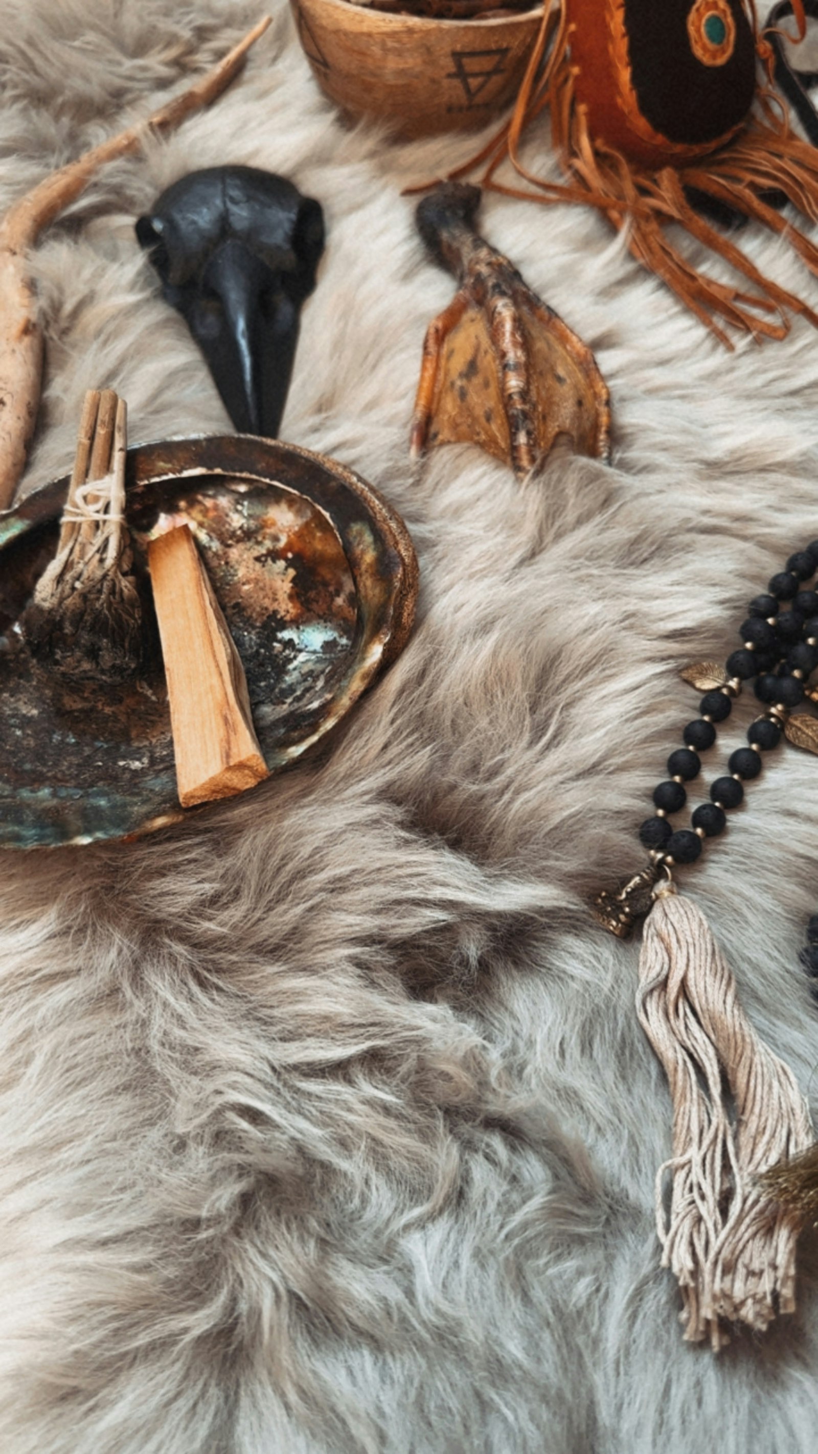 Ritual altar with crystals, palo santo, and mala beads